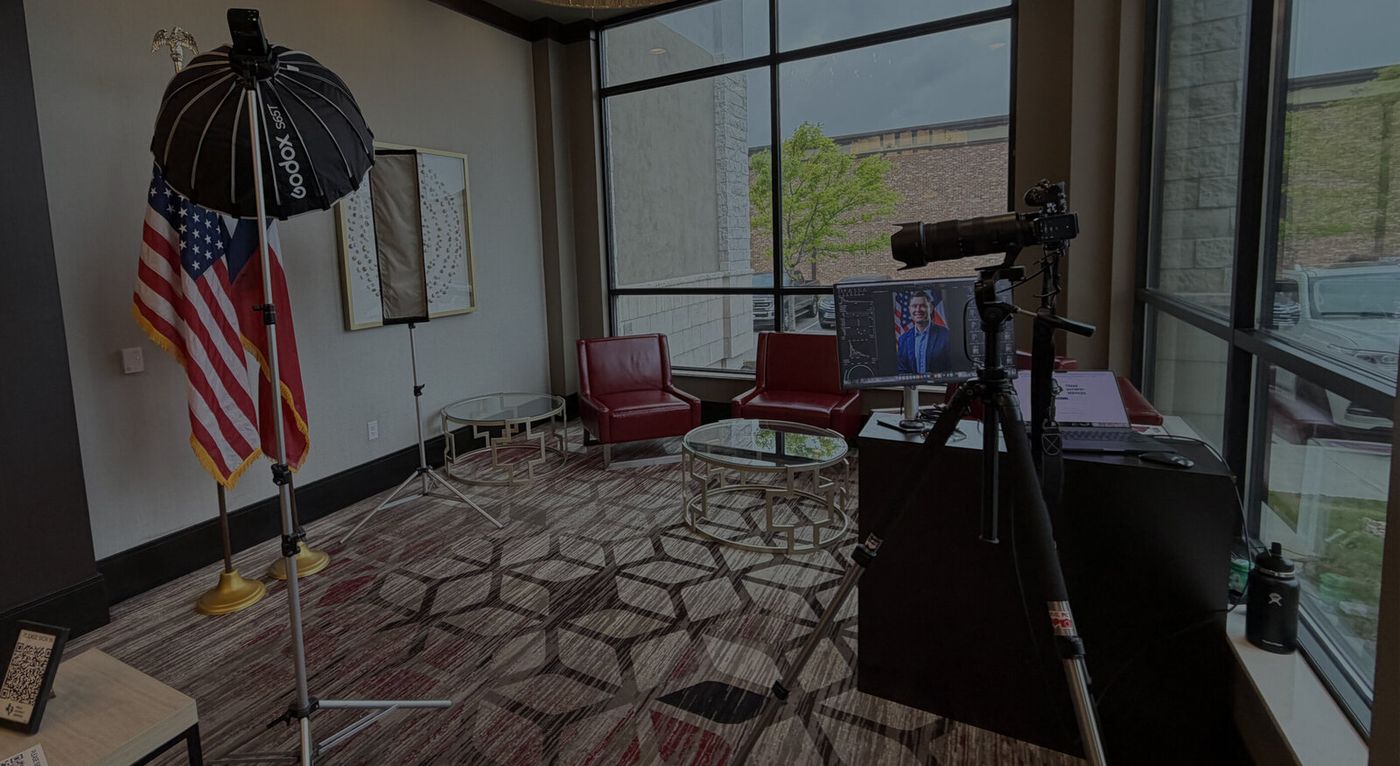 Erick's on-site studio — softbox, backdrop, and tethered Capture One workstation by the windows