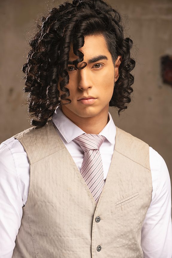 Creative professional headshot of a man in a vest and tie
